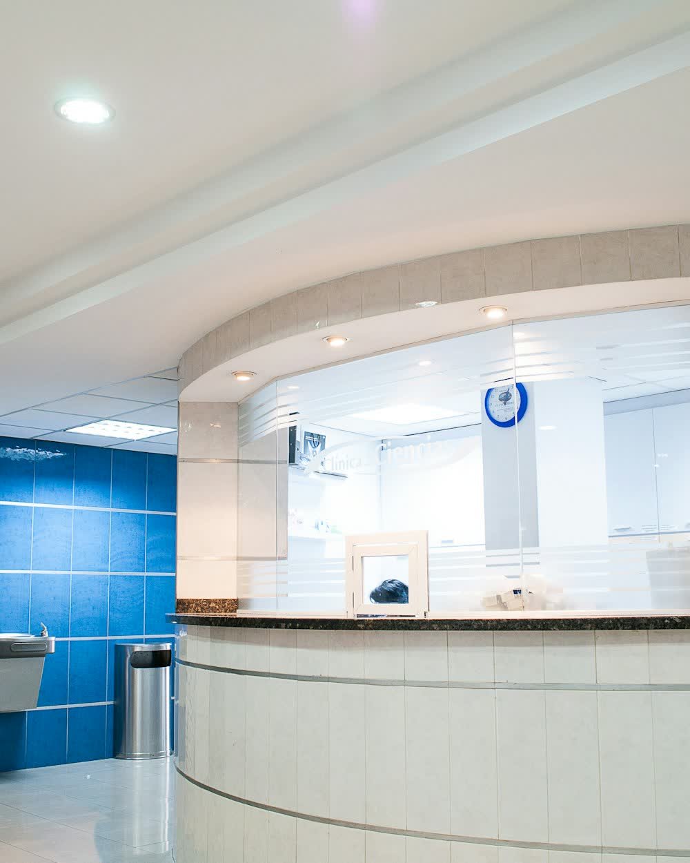 A hospital reception desk and waiting area