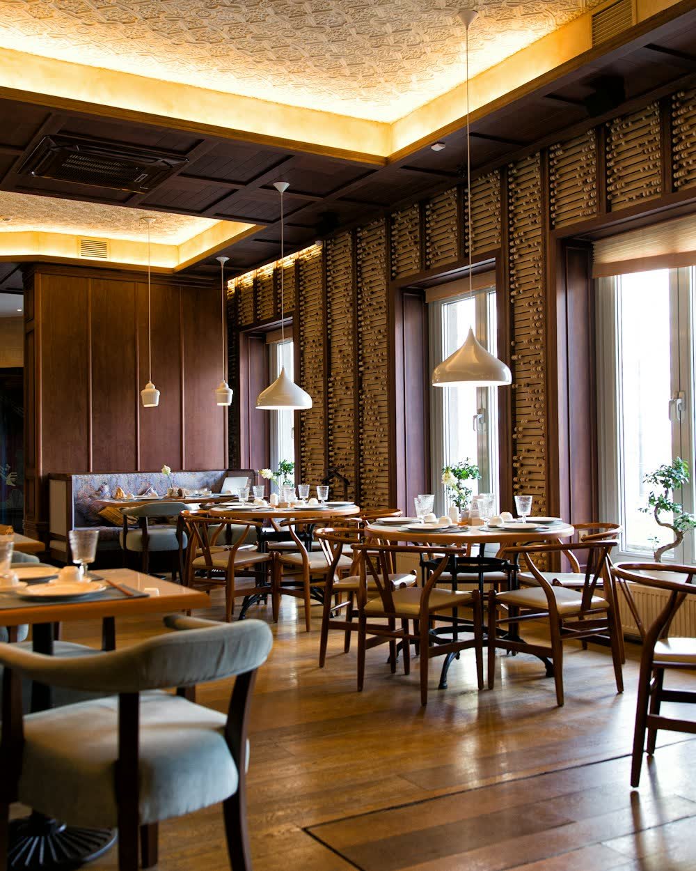 A restaurant dining room with set tables